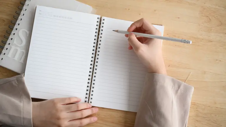 Student planning a GCSE English essay before writing.