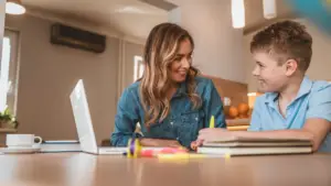 Parent and child looking for the right online tutor together.